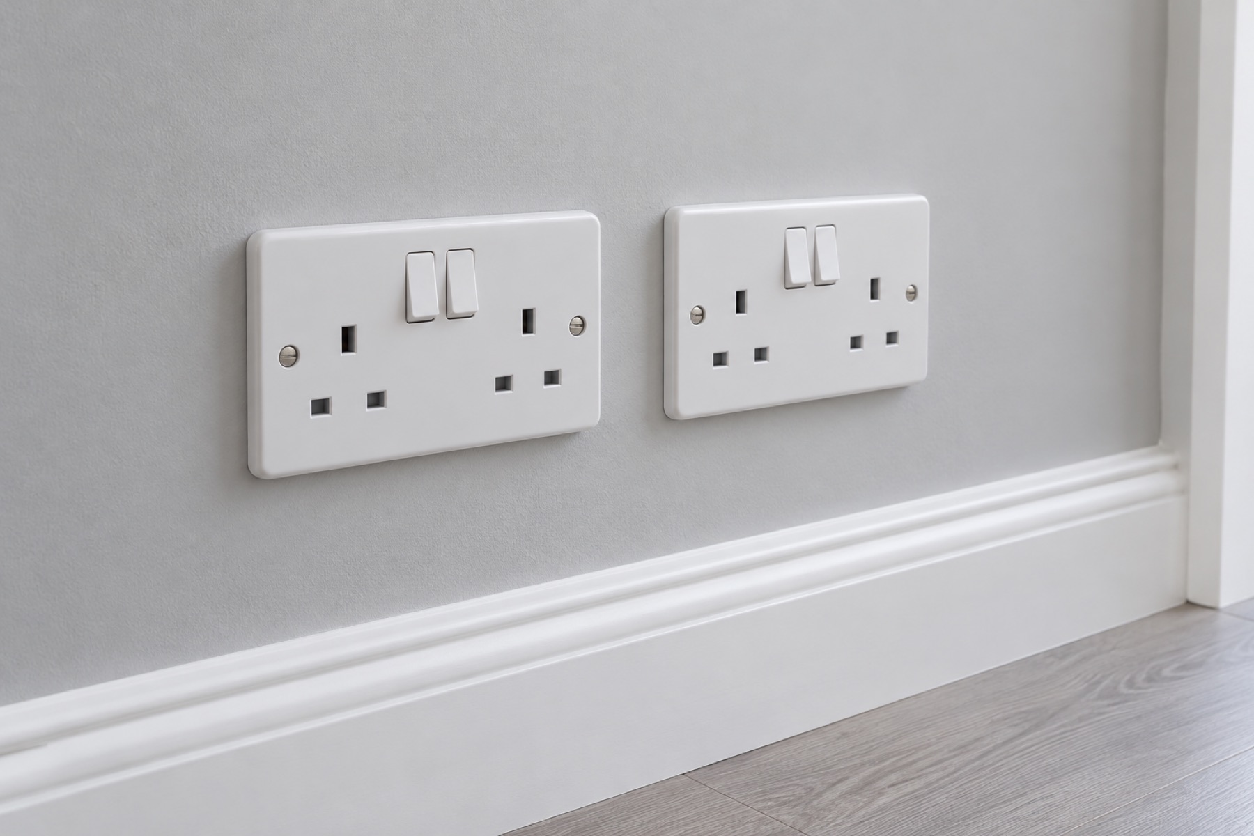 New double plug sockets on a freshly painted wall